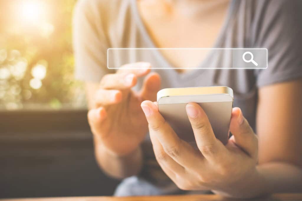 Woman searching the internet on her phone